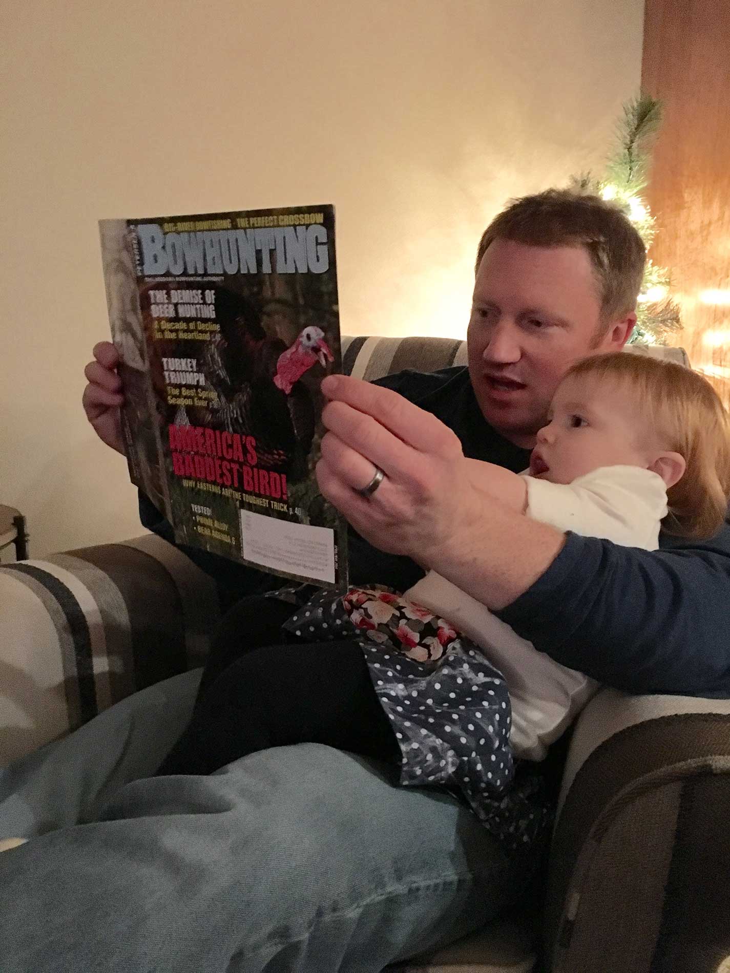 Brinley And I Reading Petersen's Bowhunting Magazine