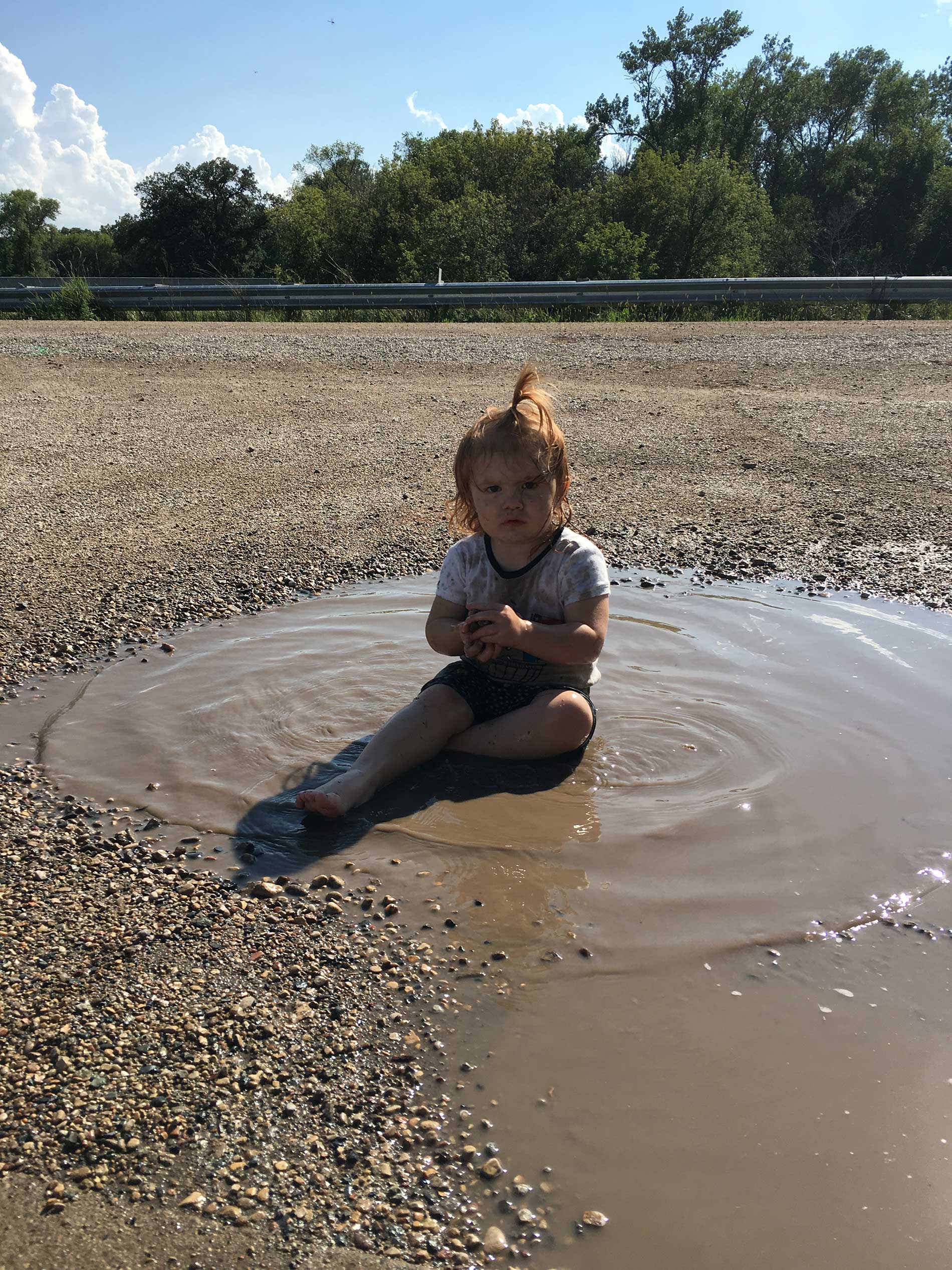 Brinley all defiant in the mud puddle